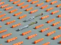 Patrón de tacos de plástico naranja y dos tacos grises con tornillos. ¡Hay muchos tipos de taco para elegir!