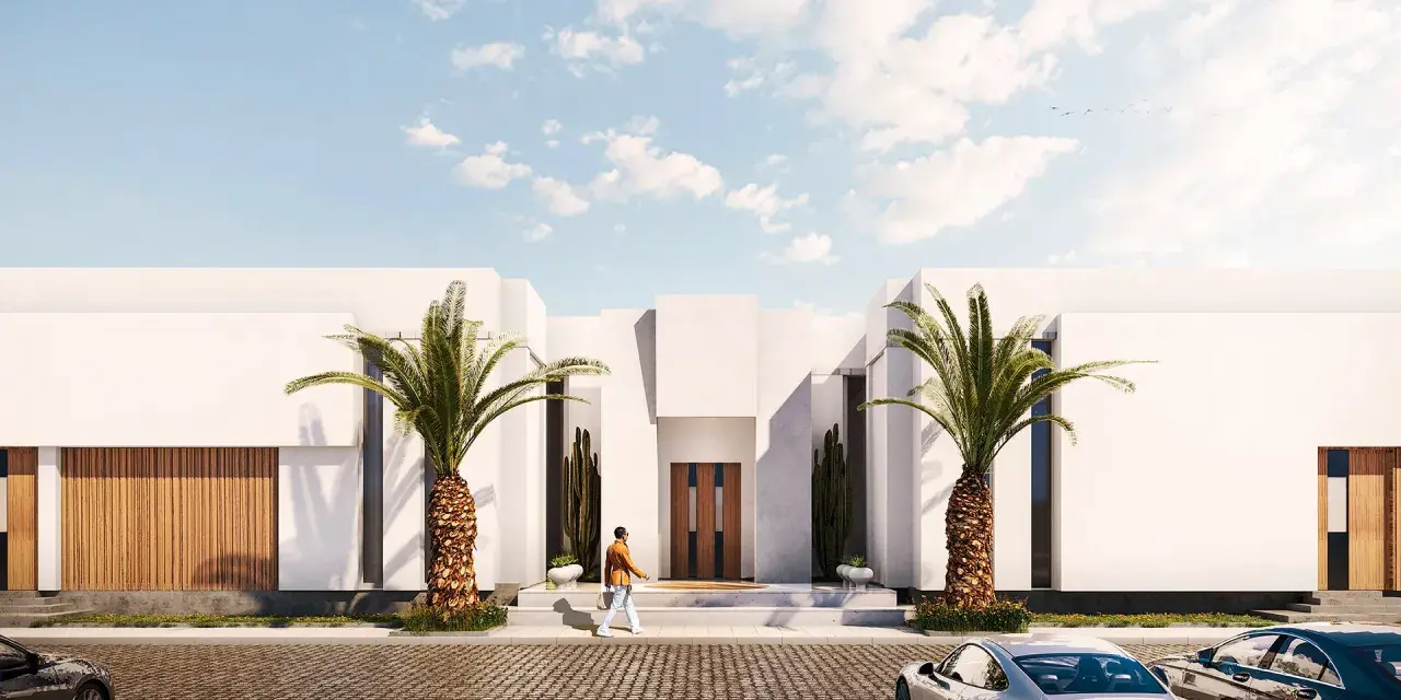 Un hombre camina hacia una casa moderna con palmeras. Se necesita proyecto para hacer un garaje.