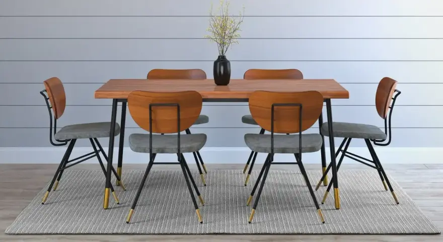 Comedor moderno con mesa de madera y seis sillas grises. La altura de una mesa es perfecta para compartir una comida.